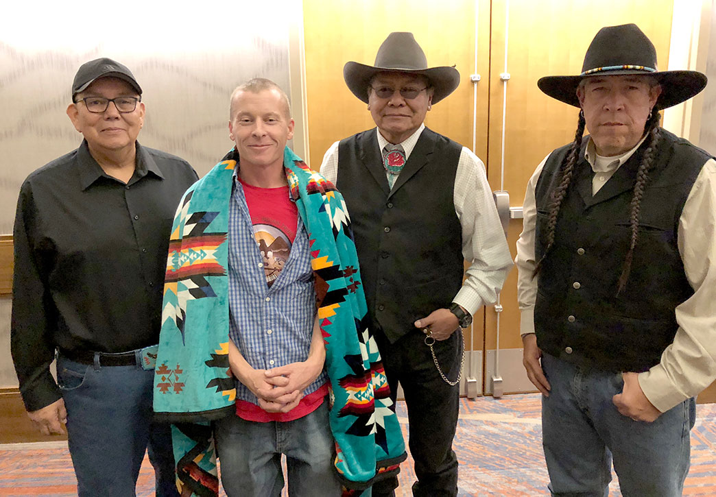 Rich Snyder honored by Ute Indian Tribe Business Committee Members at the 2018 NCAI Conference in Denver. (left to right: Councilman Ed Secakuku, Rich Snyder, Chairman Luke Duncan, and Councilman Shaun Chapoose. Photo courtesy of Ute Land Trust)